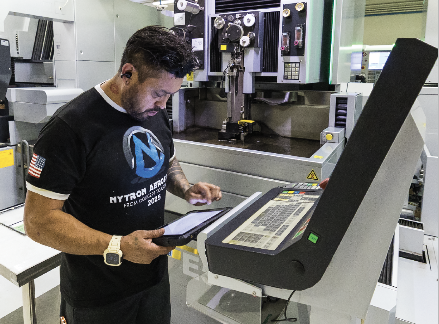 All of the machining centers are equipped with tablets for easy access to ShopXpert. Mario Coronado looks at the paperless traveler on his tablet before setting up one Nytron’s 6 Sodick wire EDMS.